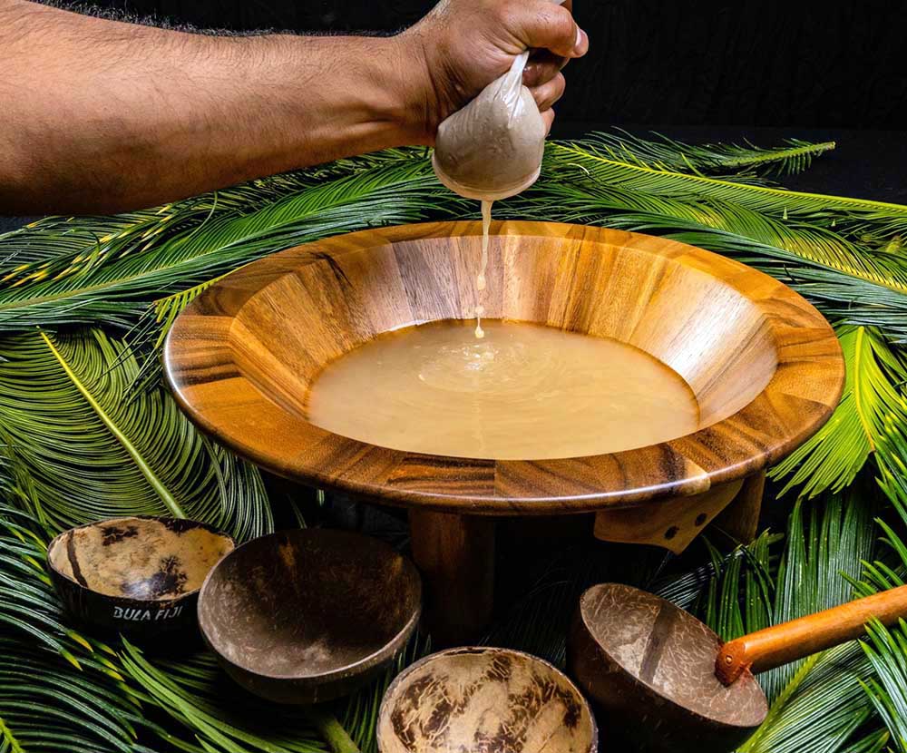 Kava being prepared in a traditional wooden bowl